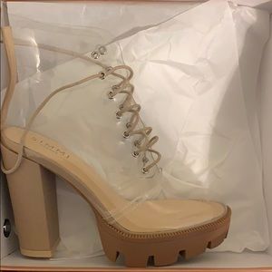 (Summit Shoes) Clear lace up platform boots.